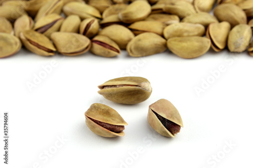 Pistachio nuts on white