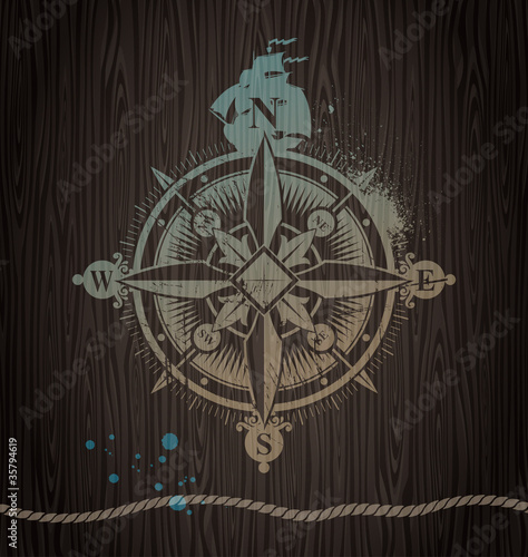 Vector compass rose painting on a wooden wall