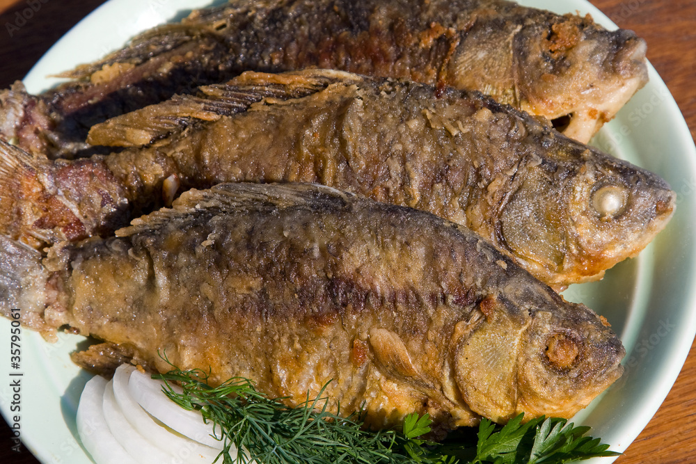 Fried fish crucian in plate