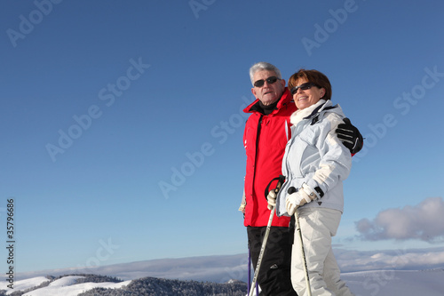 elderly couple enjoying stay at ski