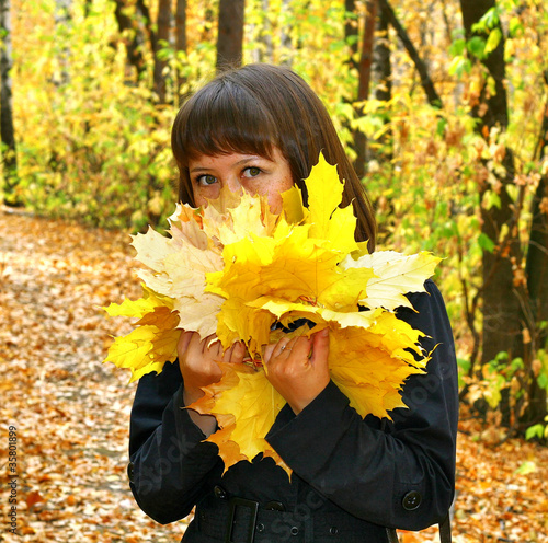 Girl in an autumn forest