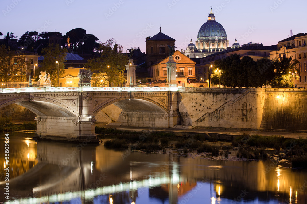 Saint Peter's Basilica Rome Italy on Tiber bank in evening
