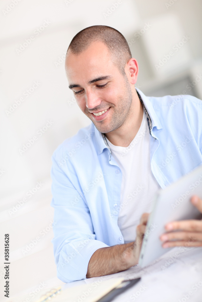 Office worker using electronic tablet