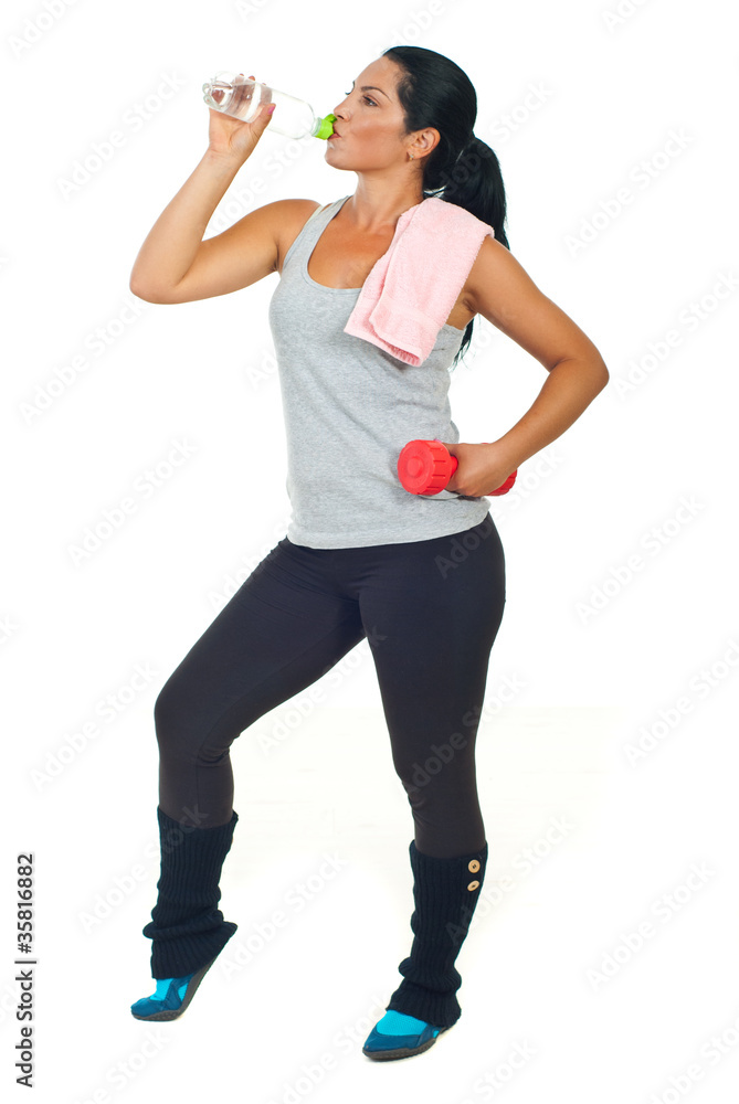 Sporty woman drinking water Sporty woman drinking water