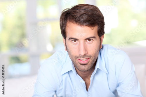 Schilderij op canvas Portrait of handsome man with blue shirt