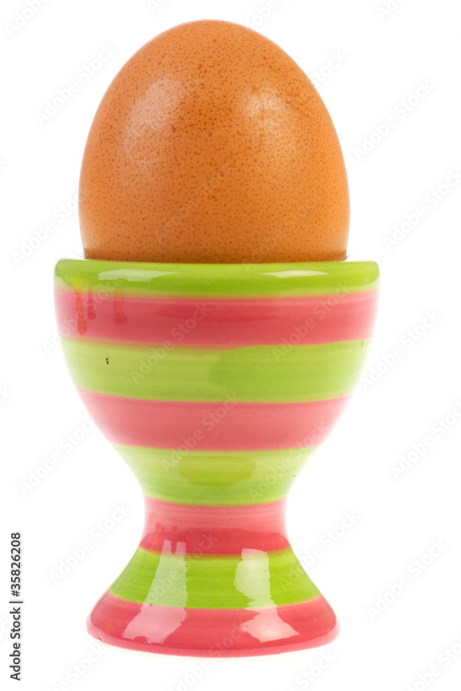 brown egg in egg-cup brown egg in egg-cup