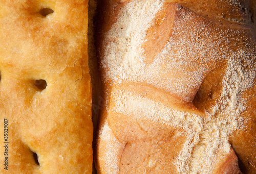 Closeup of genoese focaccia and bread.