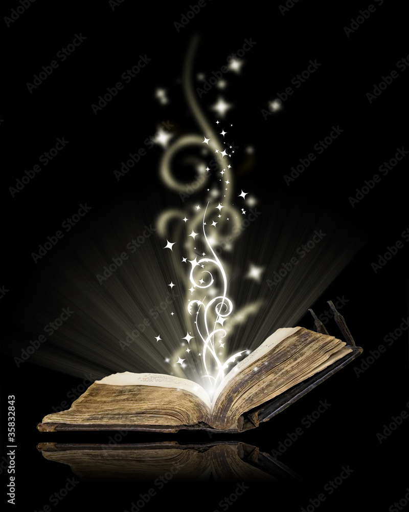 Naklejka premium Open book magic on black