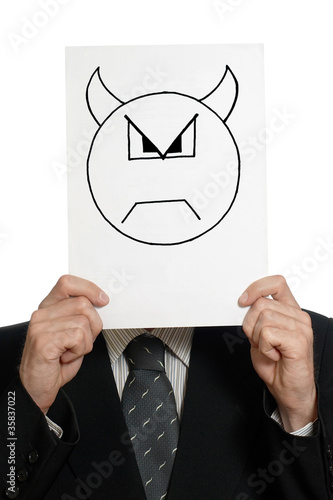 Man with painted devil face on the sheet of paper