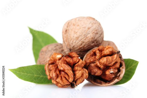 walnuts and leaves isolated on white