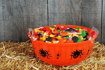 bowl of halloween candy on straw