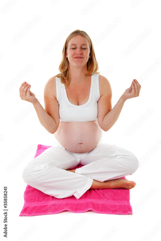 woman doing meditative pregnancy yoga woman doing meditative pregnancy yoga