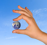 Hand with planet earth