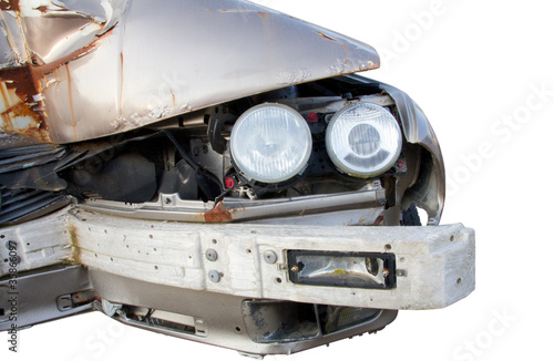 Isolated smashed car front with intact headlights