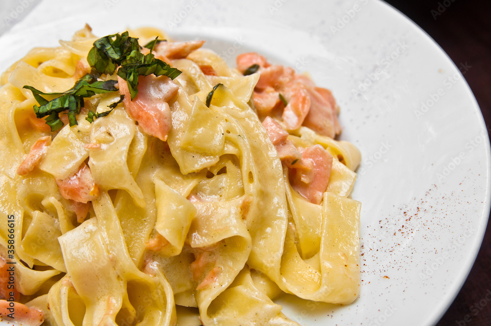tasty pasta with salmon on a the table tasty pasta with salmon on a the table