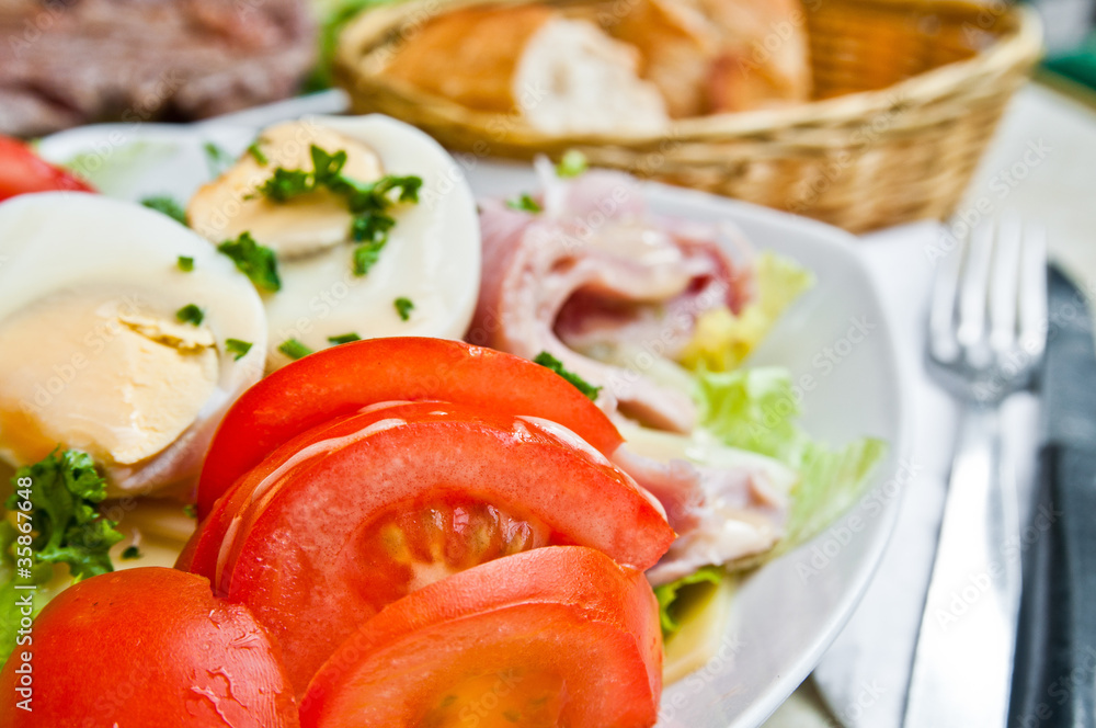 Fresh fruits salad and ham with egg Fresh fruits salad and ham with egg