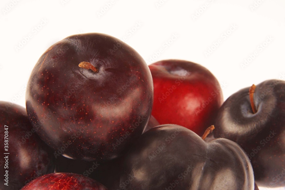 Plums on white background.