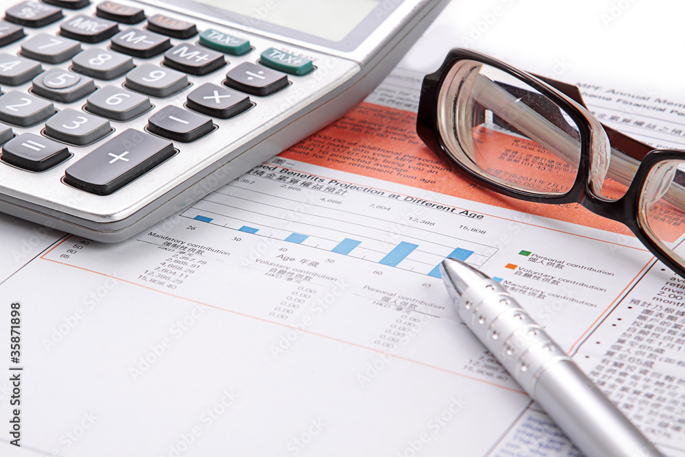 Stock chart with calculator,pen and eyeglasses Stock chart with calculator,pen and eyeglasses