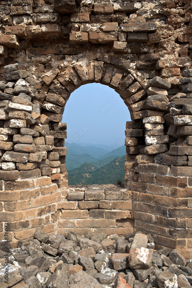 Looking out of stone brick window of Great Wall of China
