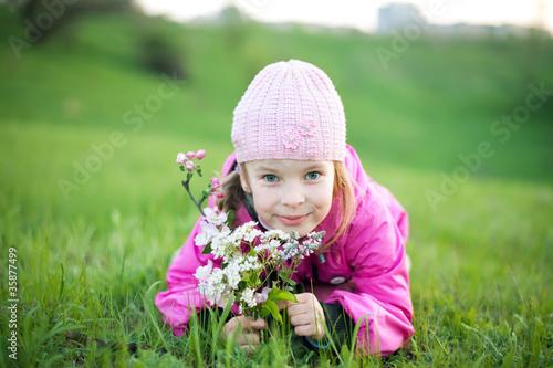 little girl with branch of flowers