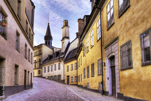 Cobblestone street with old beautiful buildings.