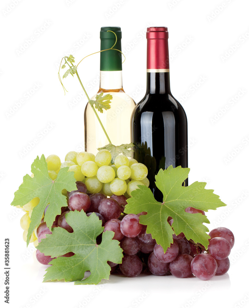 Two wine bottles and grapes