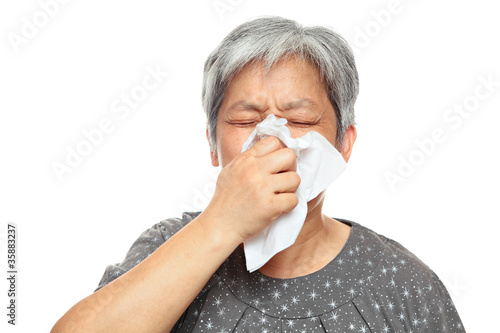 sneezing mature woman