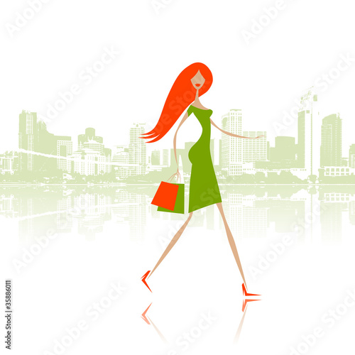 Fashion girl with shopping bags on the city street