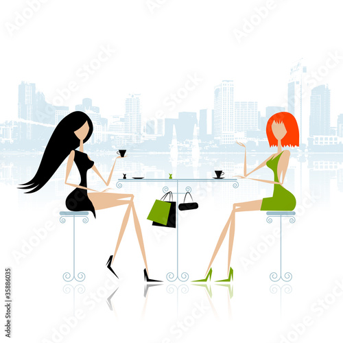 Fashion girls in cafe on the street