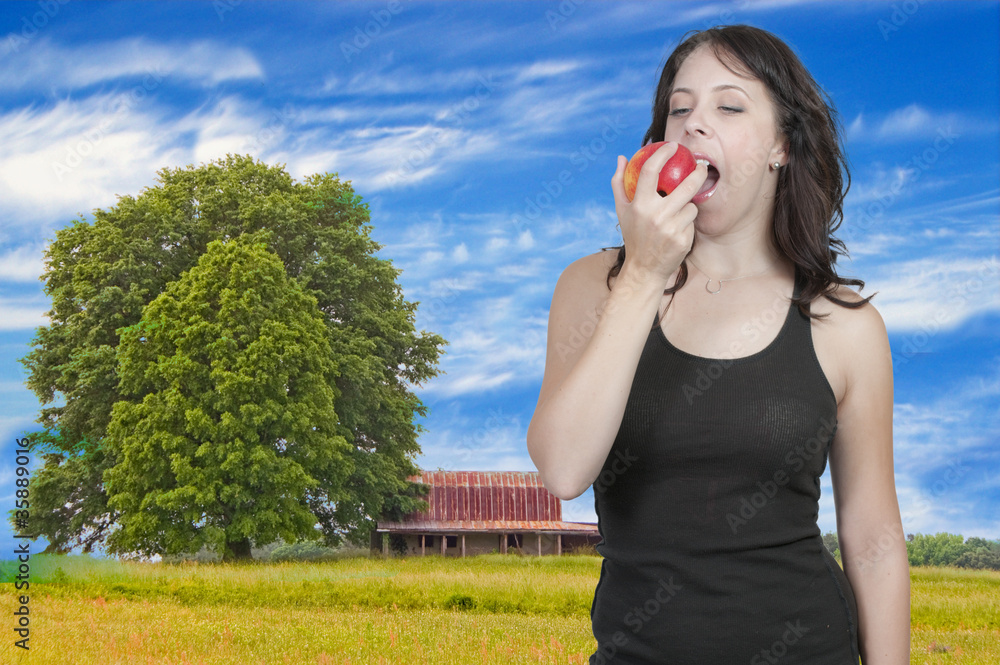 Fototapeta premium Woman Eating an Apple