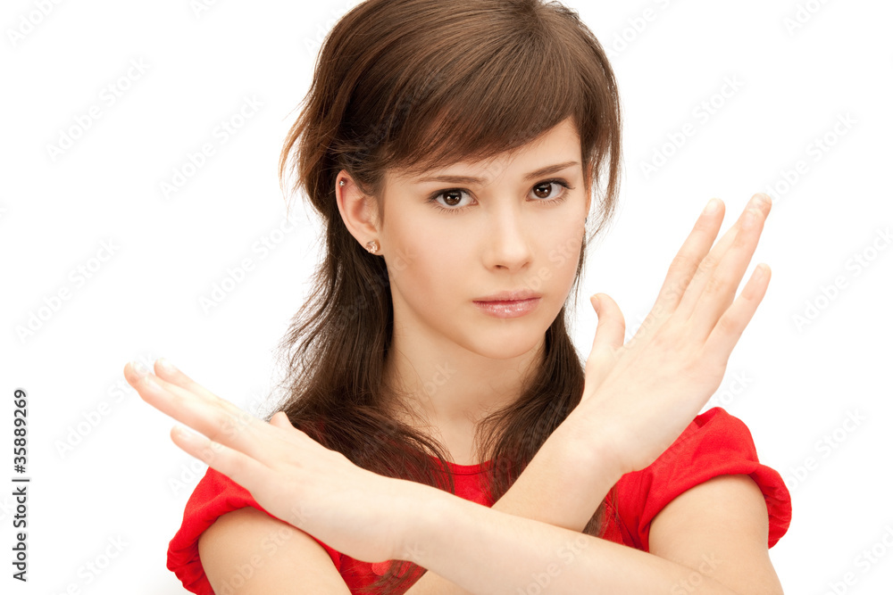 teenage girl making stop gesture teenage girl making stop gesture