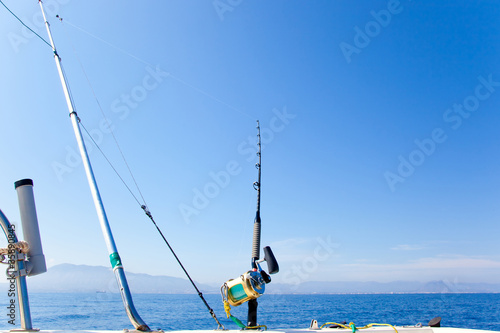 fishing boat trolling with outrigger gear