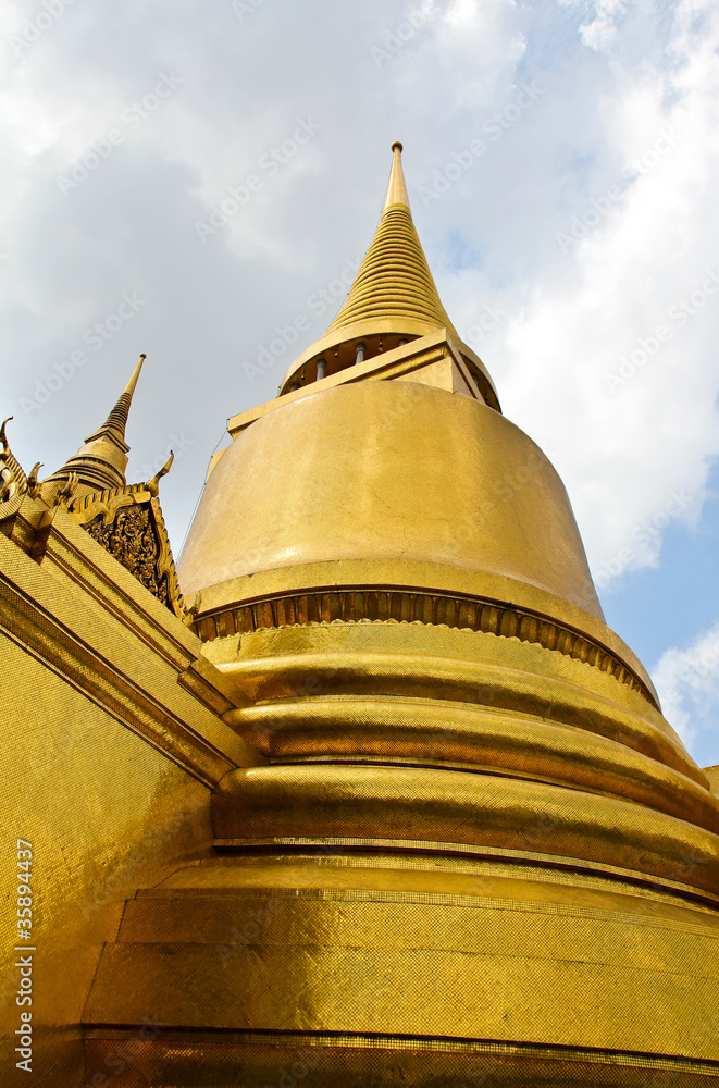 Golden pagoda inside emerald temple, thailand.
