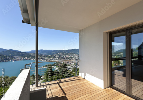 Modern apartment  balcony overlooking the lake