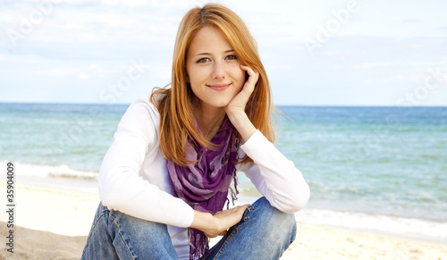 Young beautiful girl at the beach © Masson