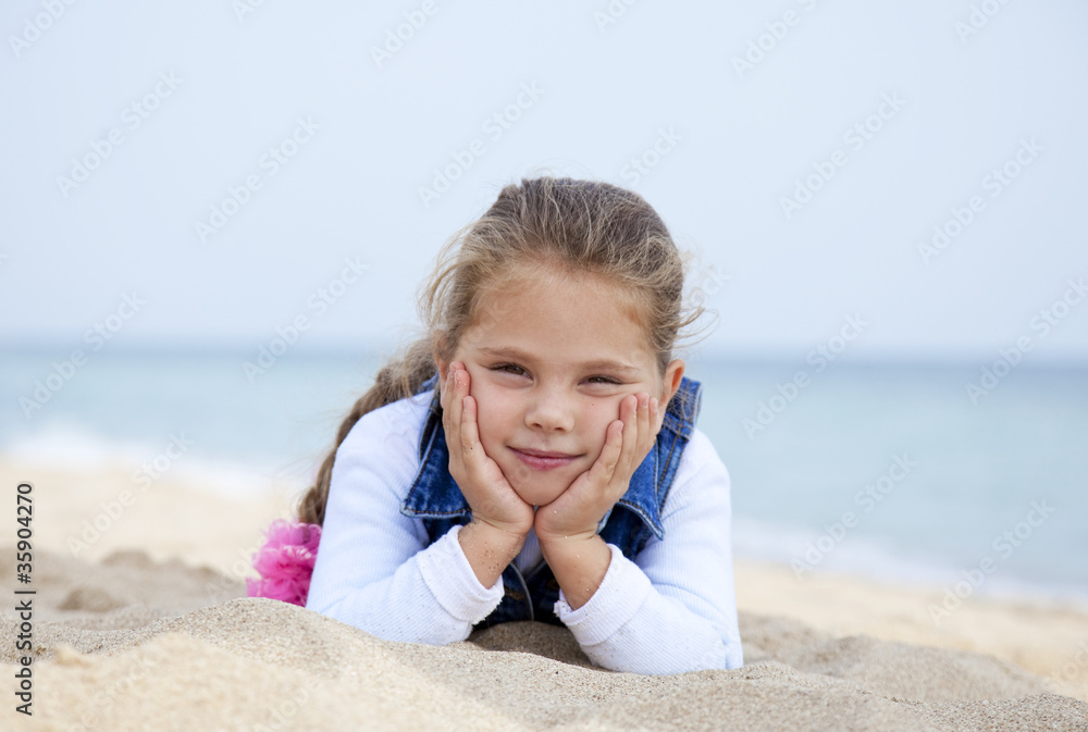Portrait of cute young girl on the beach