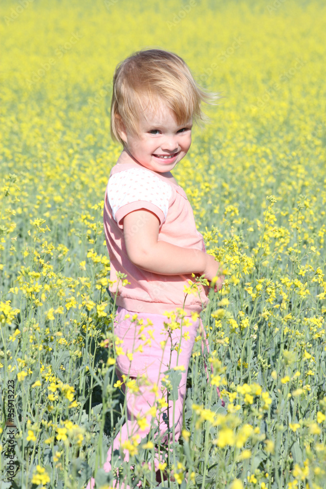 The lovely happy girl on the nature in the afternoon The lovely happy girl on the nature in the afternoon