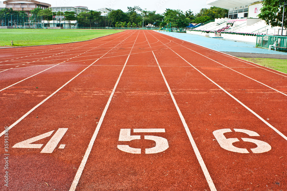 Number four  five and six on the start of a running track