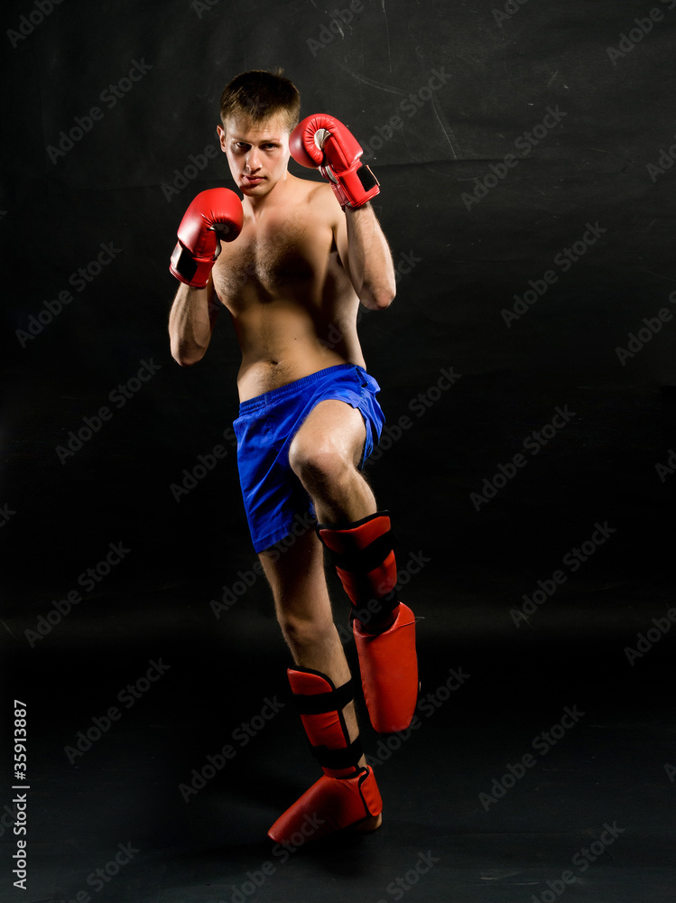 Portrait of young man with boxing  gloves
