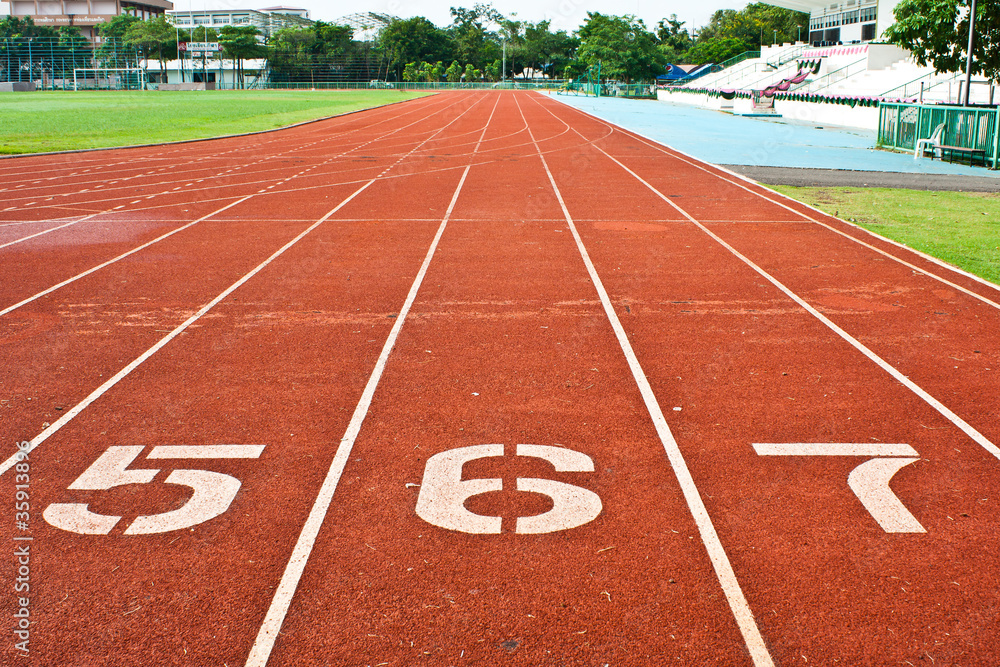 Fototapeta premium Number five six and seven on the start of a running track