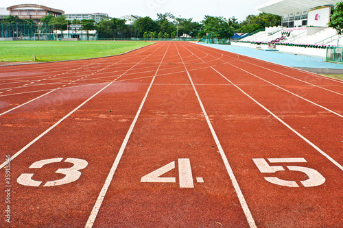 Number three four and five on the start of a running track