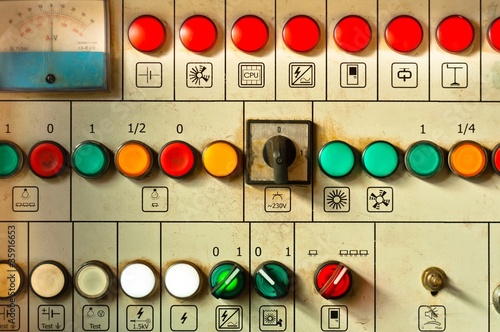 Many big buttons on an industrial board photo