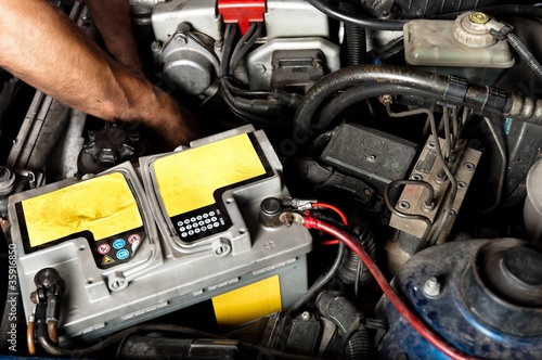 Worker repairing car