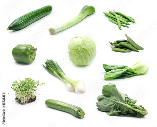 Collection of green vegetables on white background