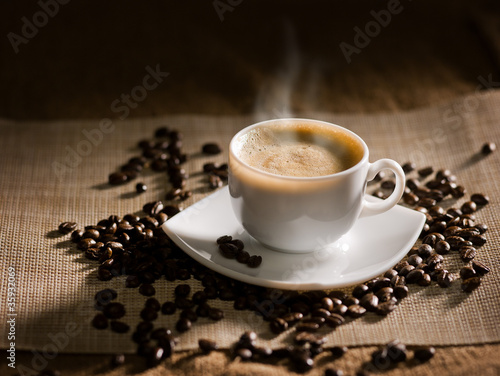 warm cup of coffee on brown background © kikala