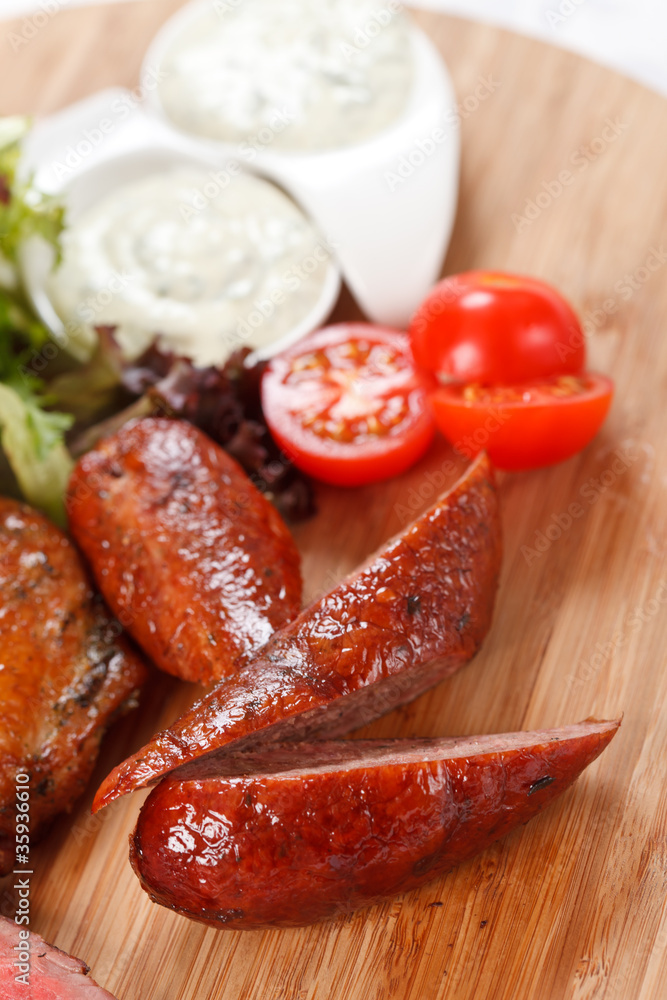 sausages on a wooden cutting board sausages on a wooden cutting board