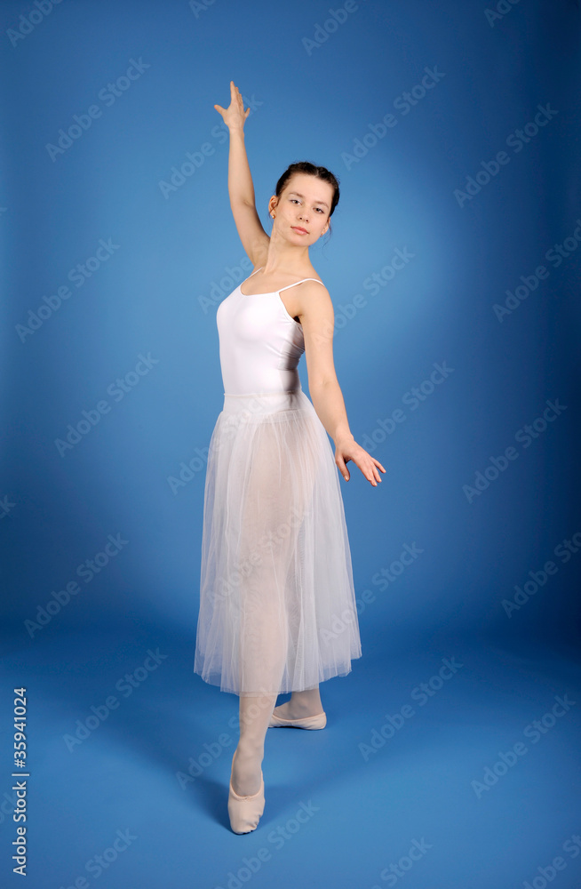 Ballet dancer posing in white skirt Ballet dancer posing in white skirt