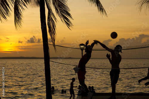 beach volleyball, sunset on the beach photo