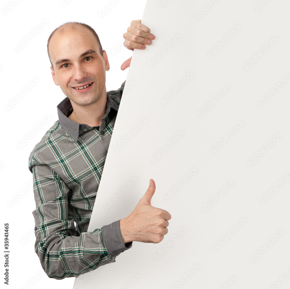 smiling young handsome man with blank banner smiling young handsome man with blank banner