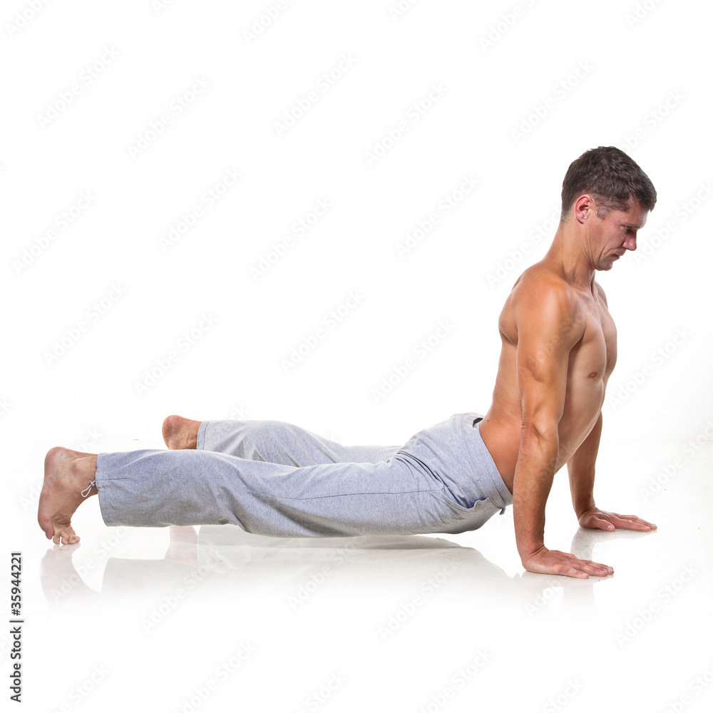 Obraz premium Man is making yoga